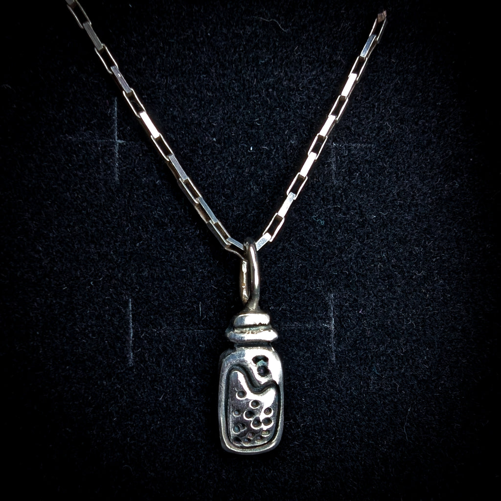 Fine silver potion bottle on vintage sterling chain