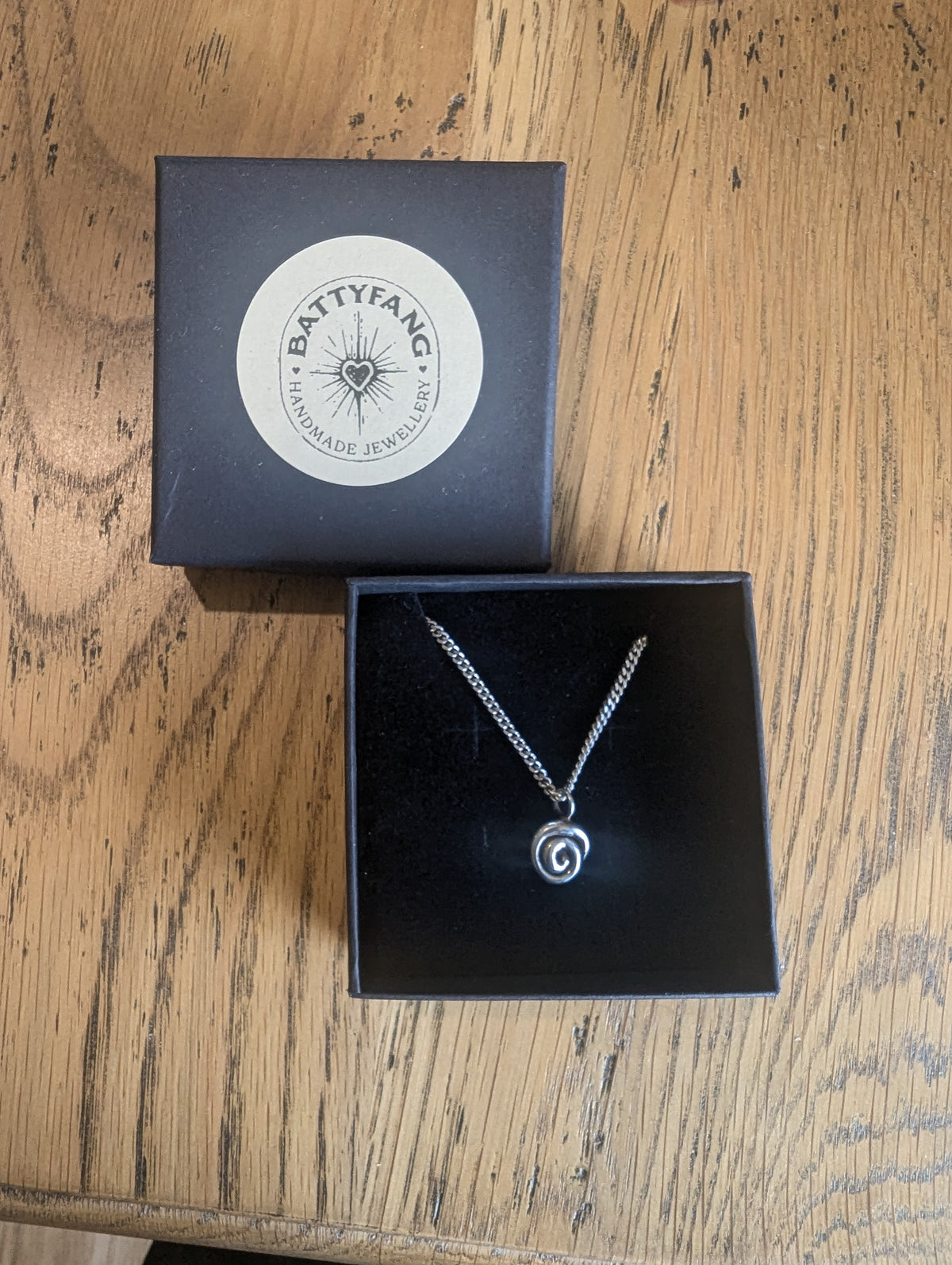 Fine silver spiral pendant on vintage sterling chain