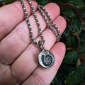 Fine silver spiral ammonite pendant on vintage sterling chain