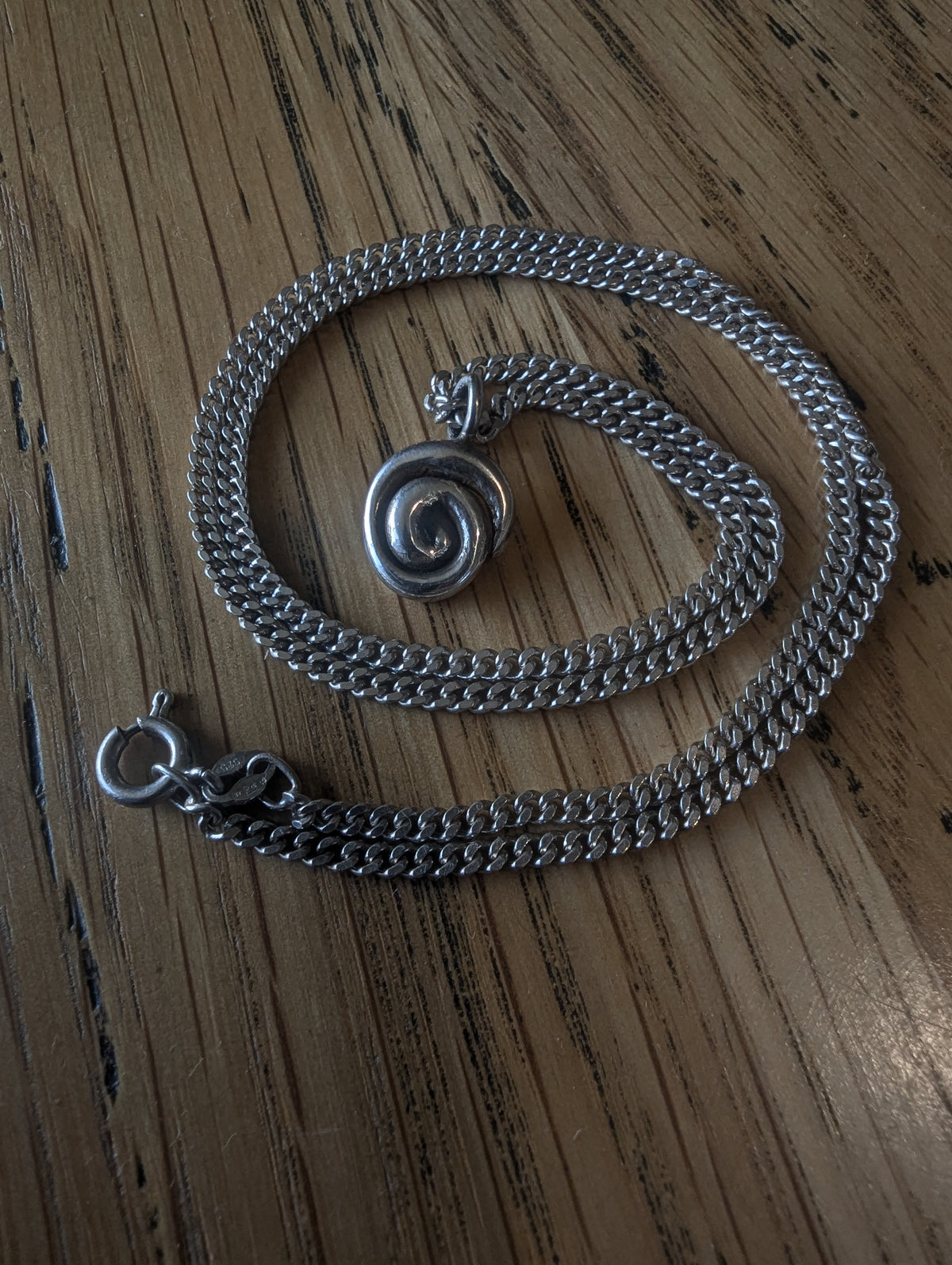 Fine silver spiral pendant on vintage sterling chain