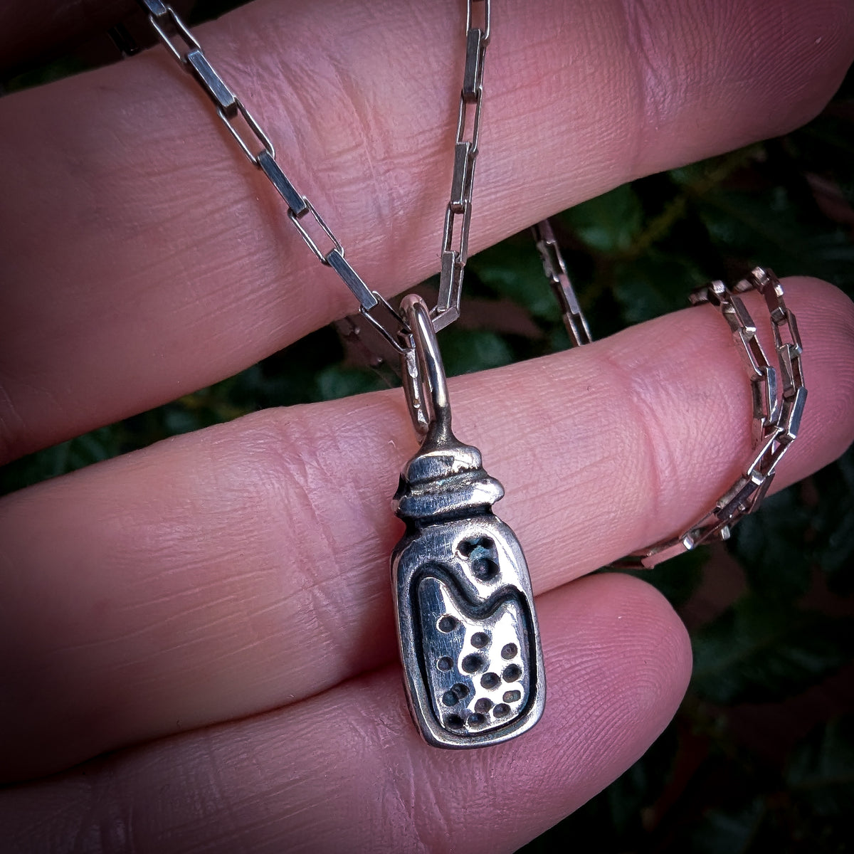 Fine silver potion bottle on vintage sterling chain