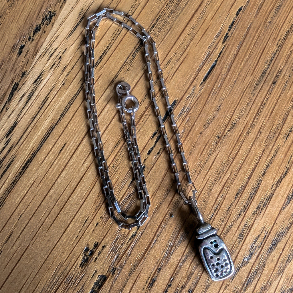 Fine silver potion bottle on vintage sterling chain