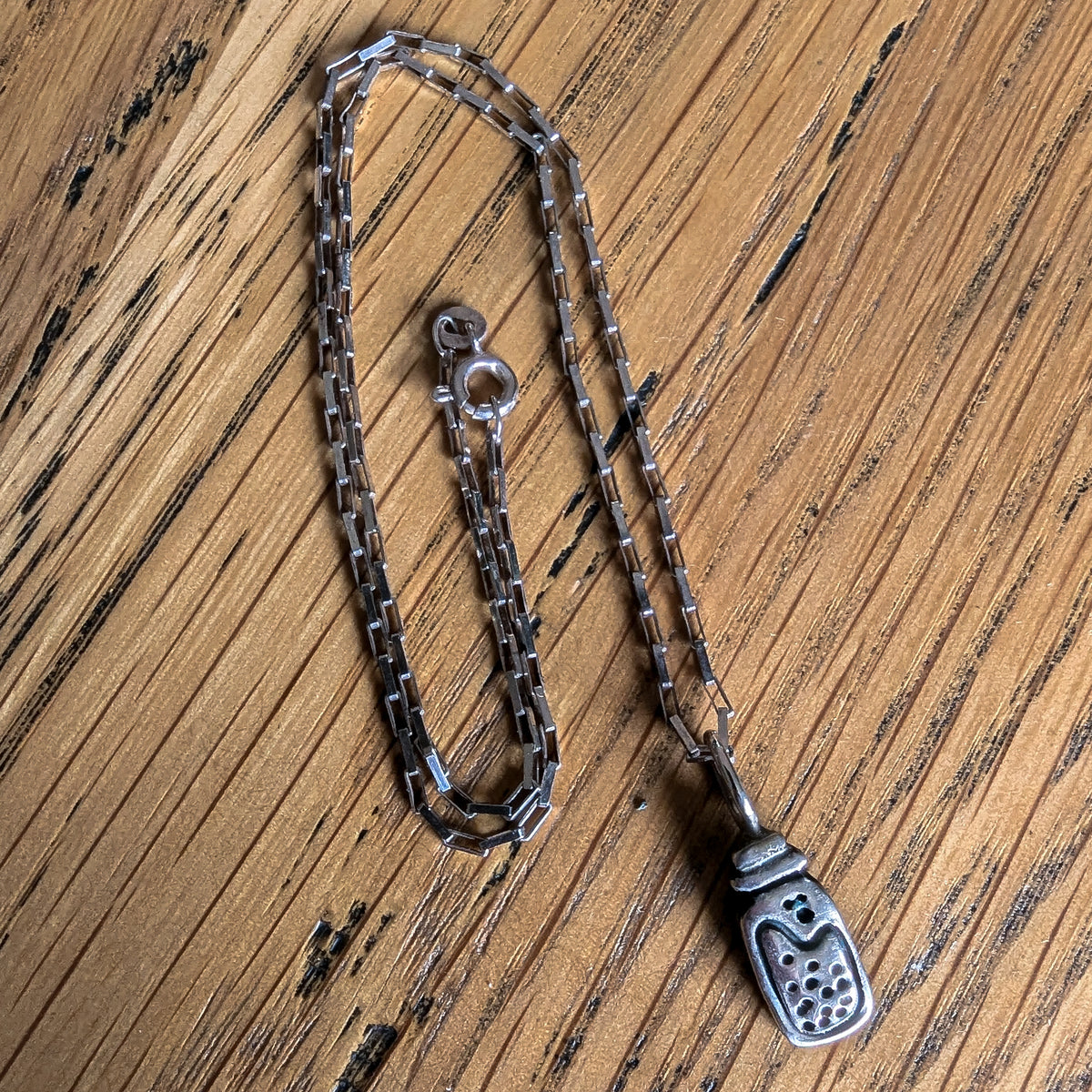 Fine silver potion bottle on vintage sterling chain